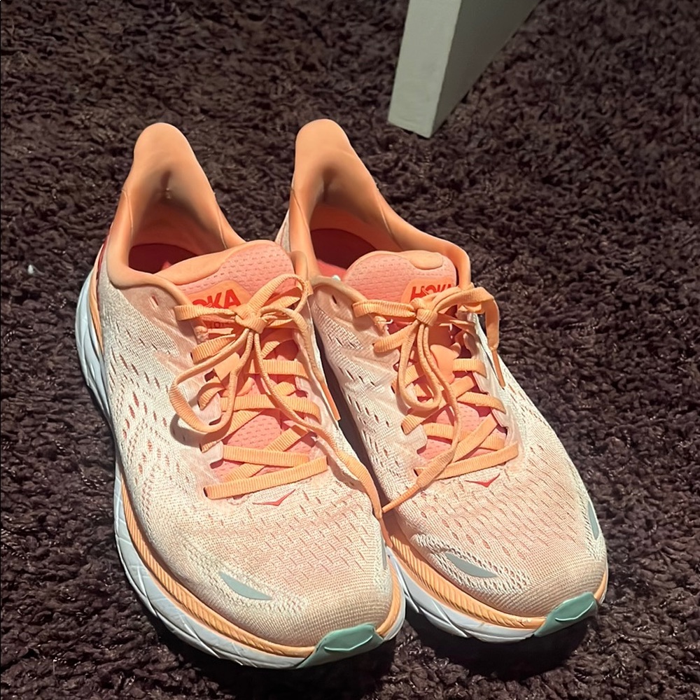 Hoka Orange Athletic Shoes Sleek Design Cushioned Sole